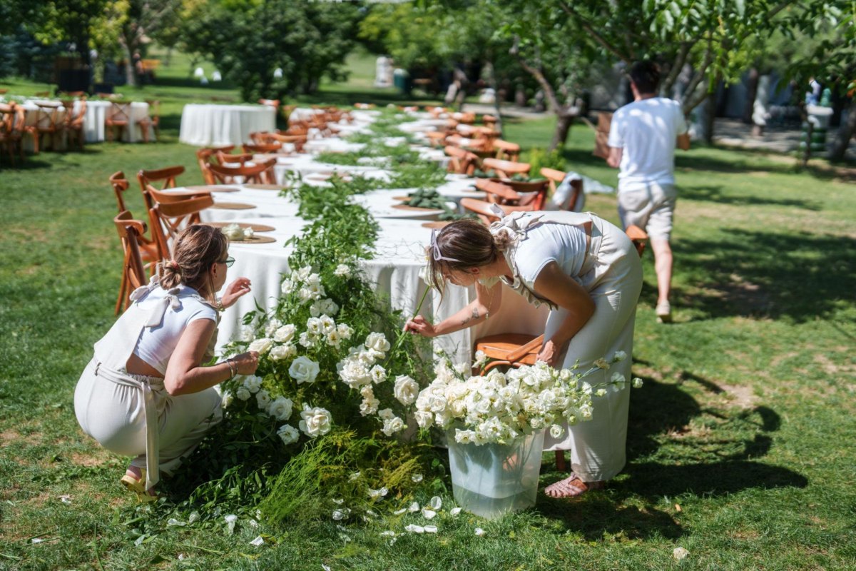 Friends helping prepare wedding reception