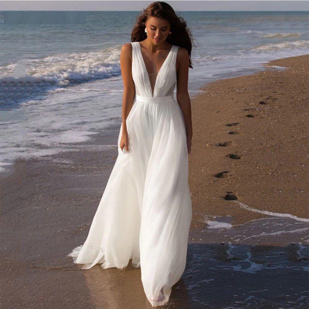 Lightweight beach wedding dress by ocean