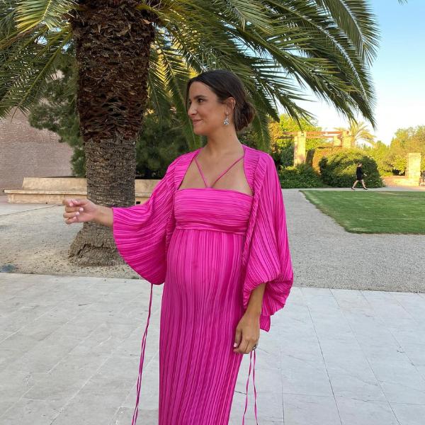 Pregnant guest wearing colorful dress