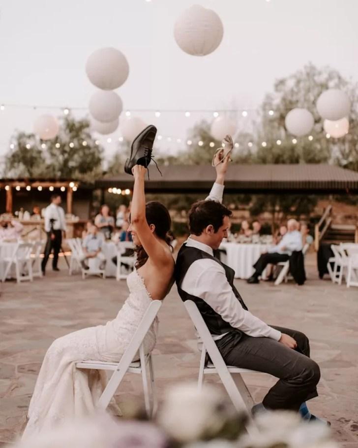 Couple playing wedding shoe game