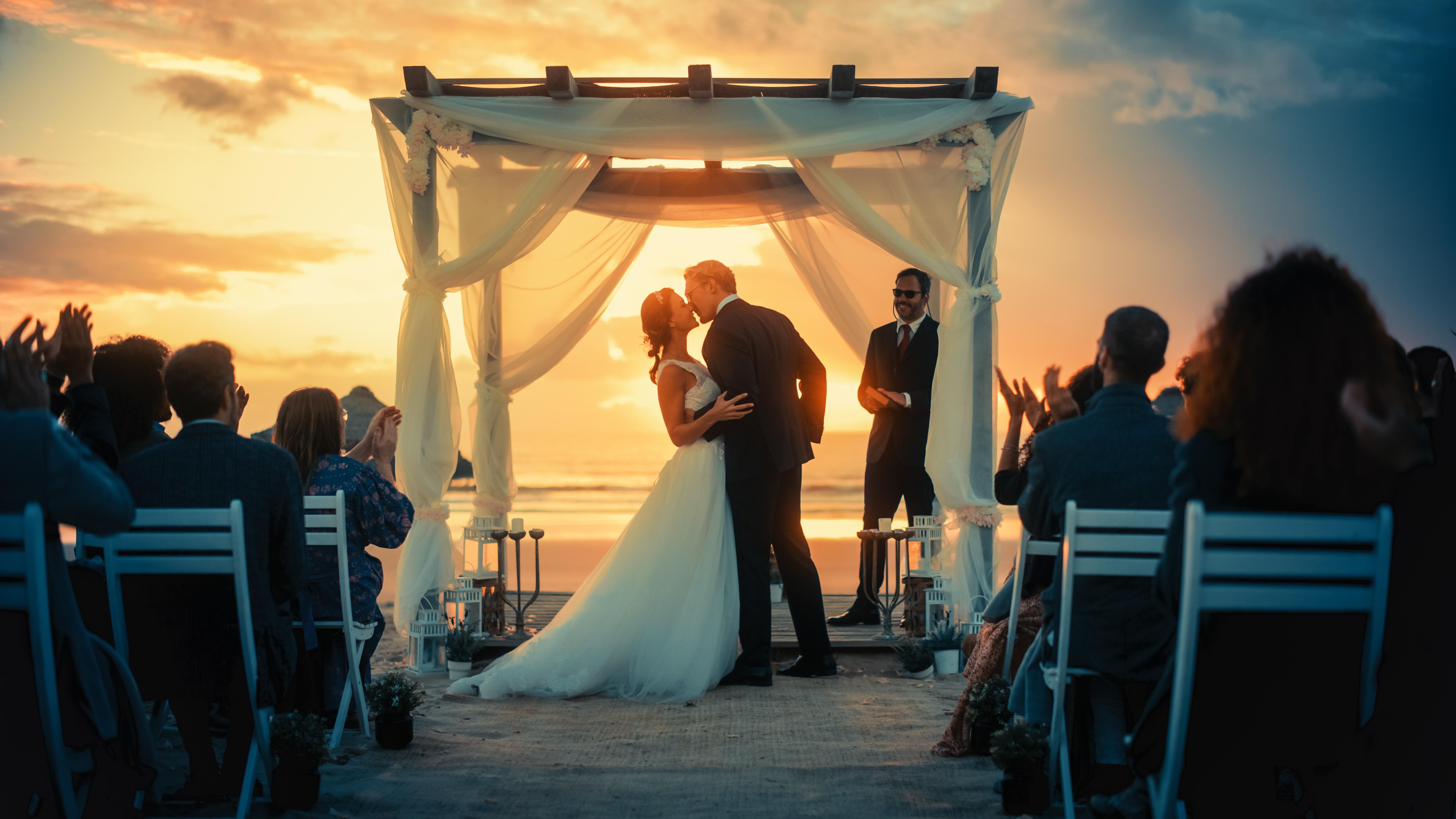 Bride and groom with a romantic novel inspired wedding reading