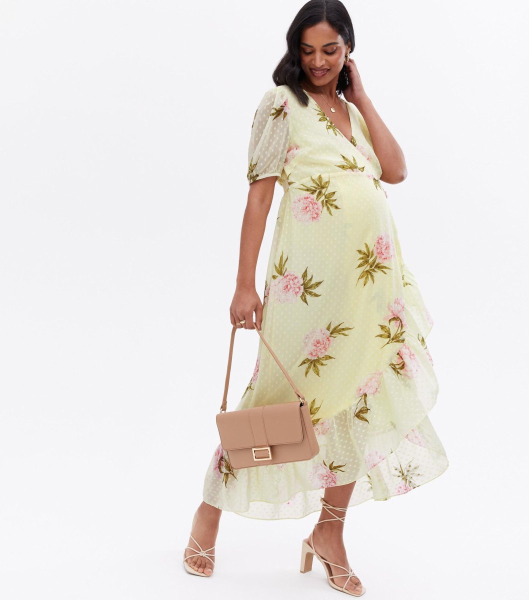 Pregnant guest wearing wrap dress