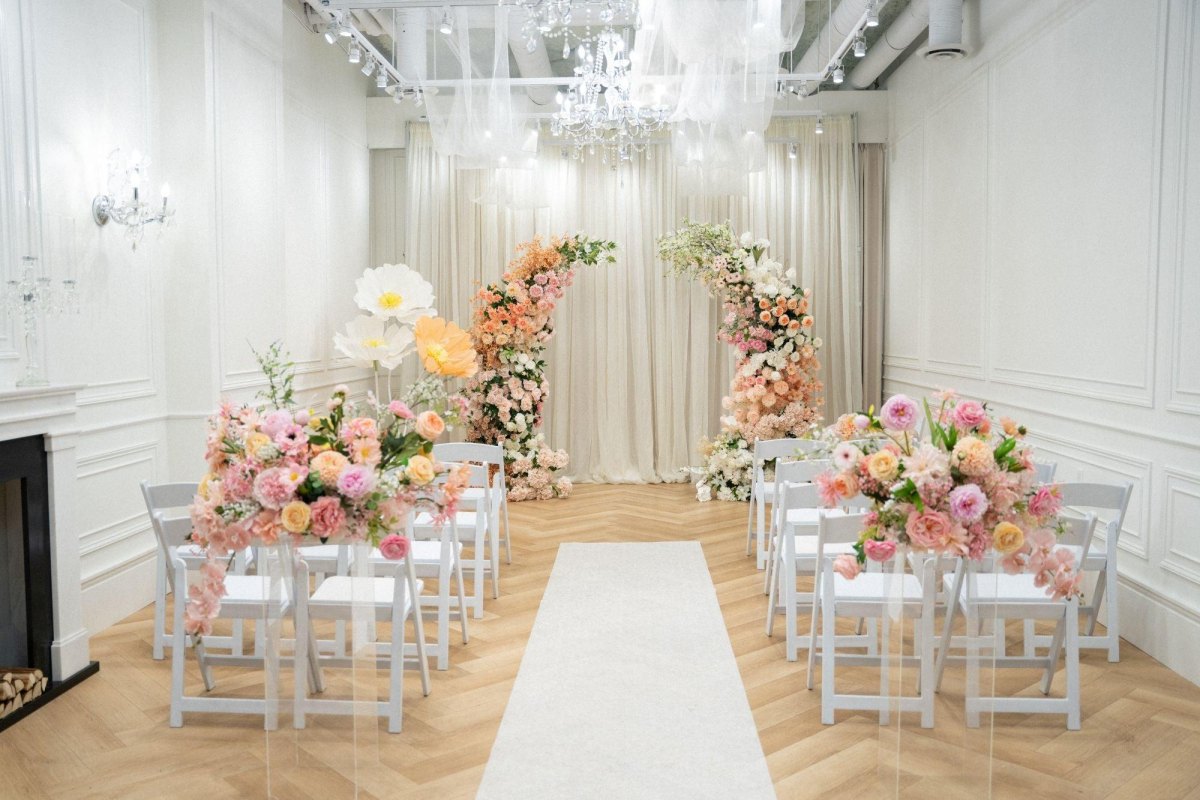 Floral backdrop for indoor wedding ceremony
