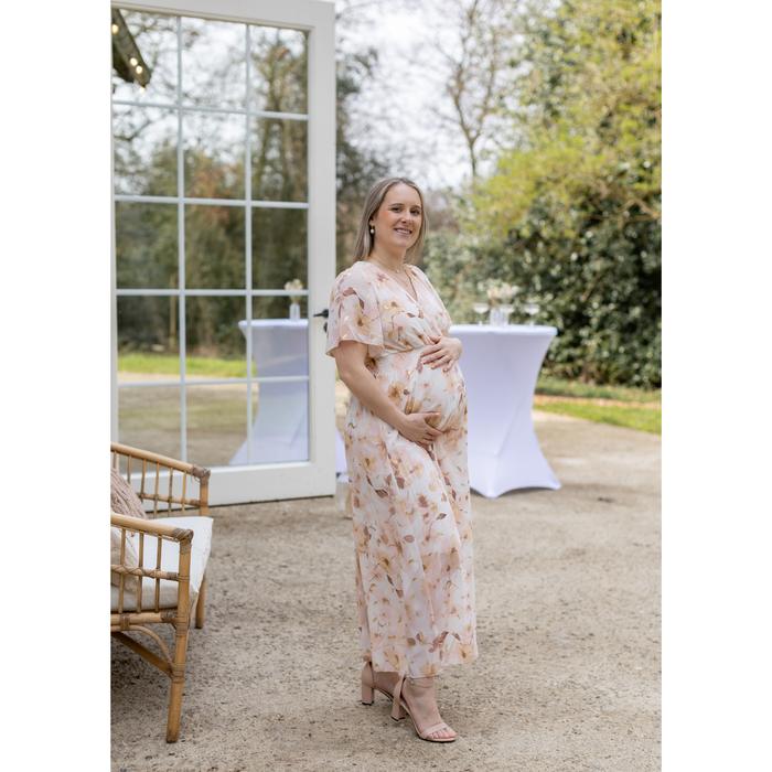 Pregnant guest wearing floral dress