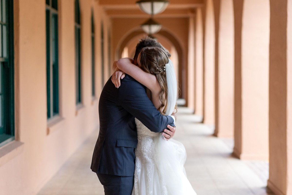 Couple reunion wedding embrace