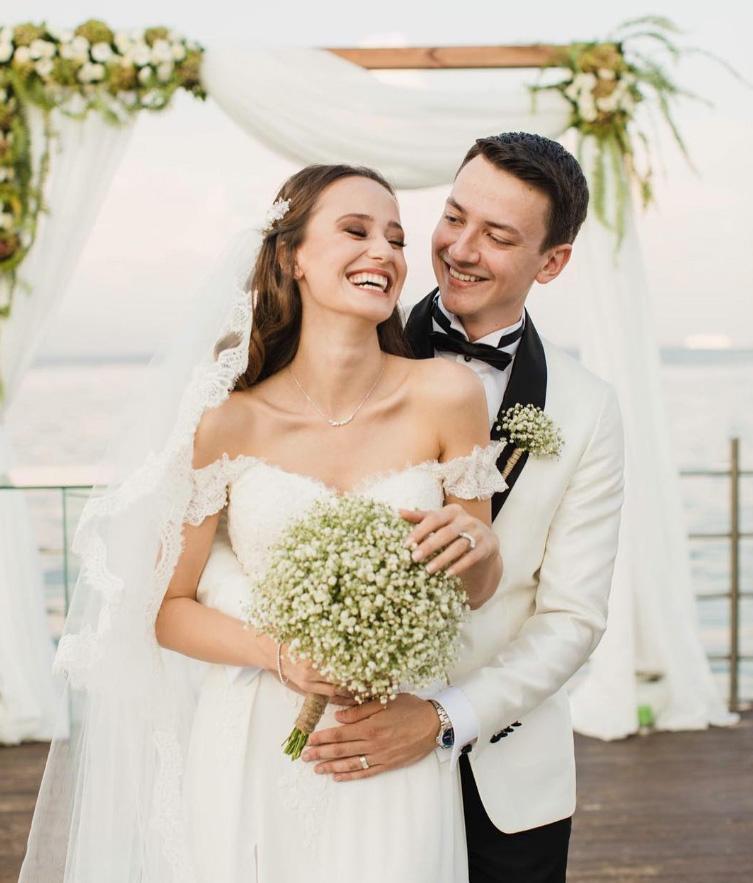 Happy newlyweds smiling together outdoors