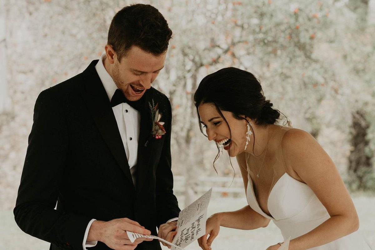 Couple sharing private joke wedding