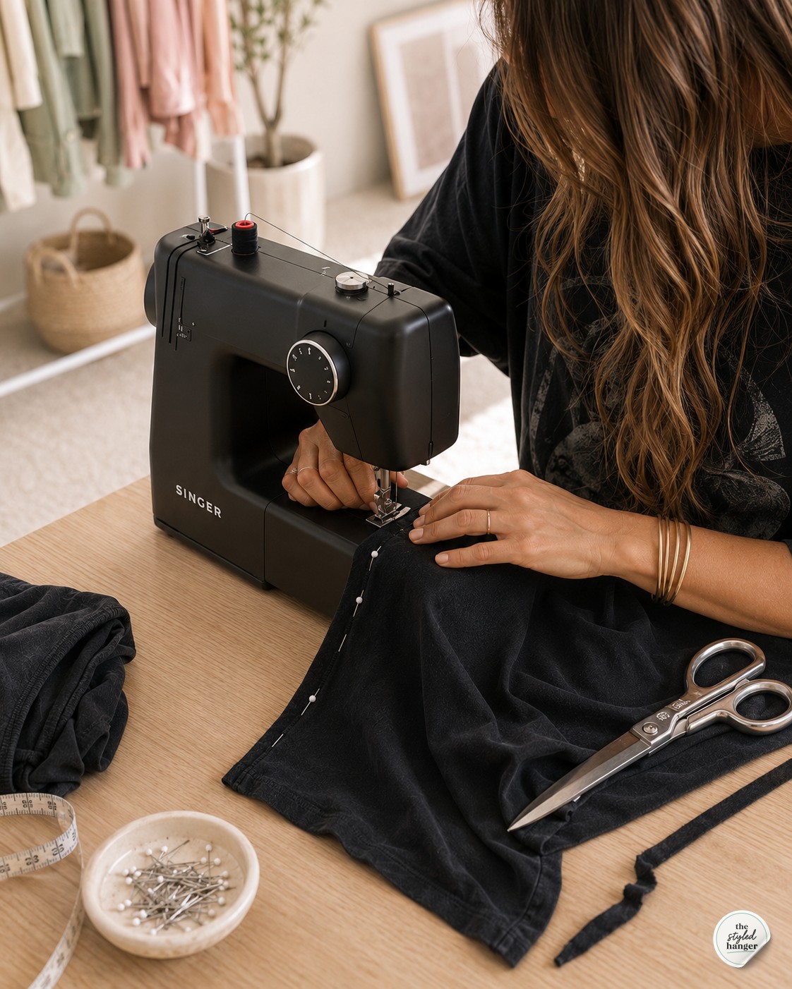 Sewing a straight side seam on a home sewing machine for a graphic tshirt dress DIY project.