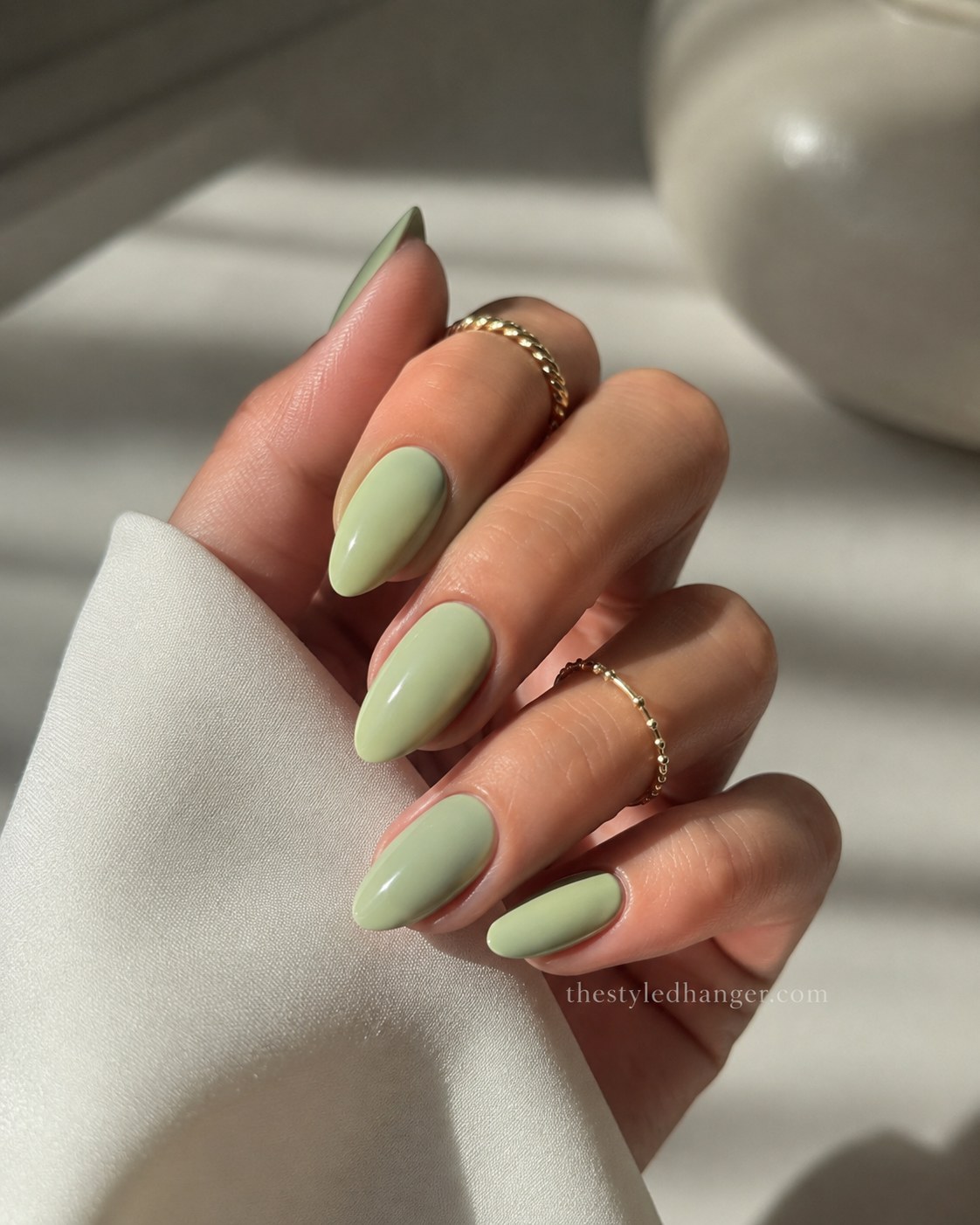 This soft pistachio sage is a wearable, everyday pick among green nail shades for beginners.