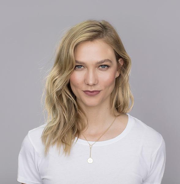Karlie Kloss wearing a sleek fashion forward outfit