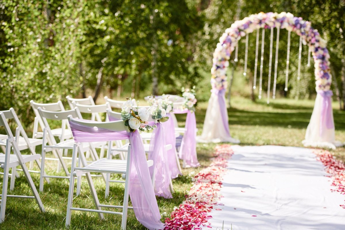 Lavender floral arch wedding aisle