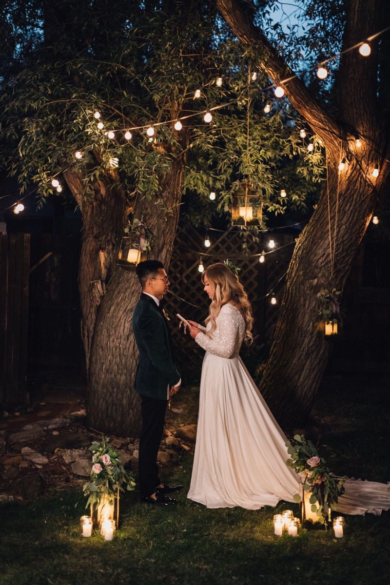 Evening backyard elopement with lights