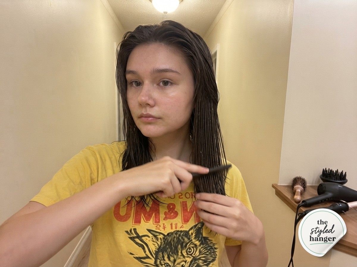 Applying volumizing mousse through mid-lengths to prep a medium length wolf cut for blow-drying