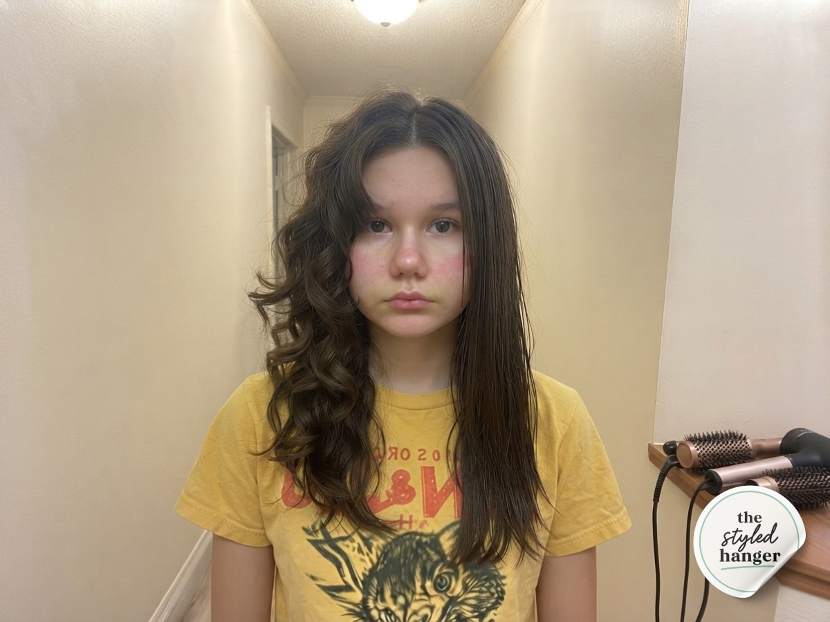 Half-curled, half-straight hair shows the dramatic before and after of a medium length wolf cut