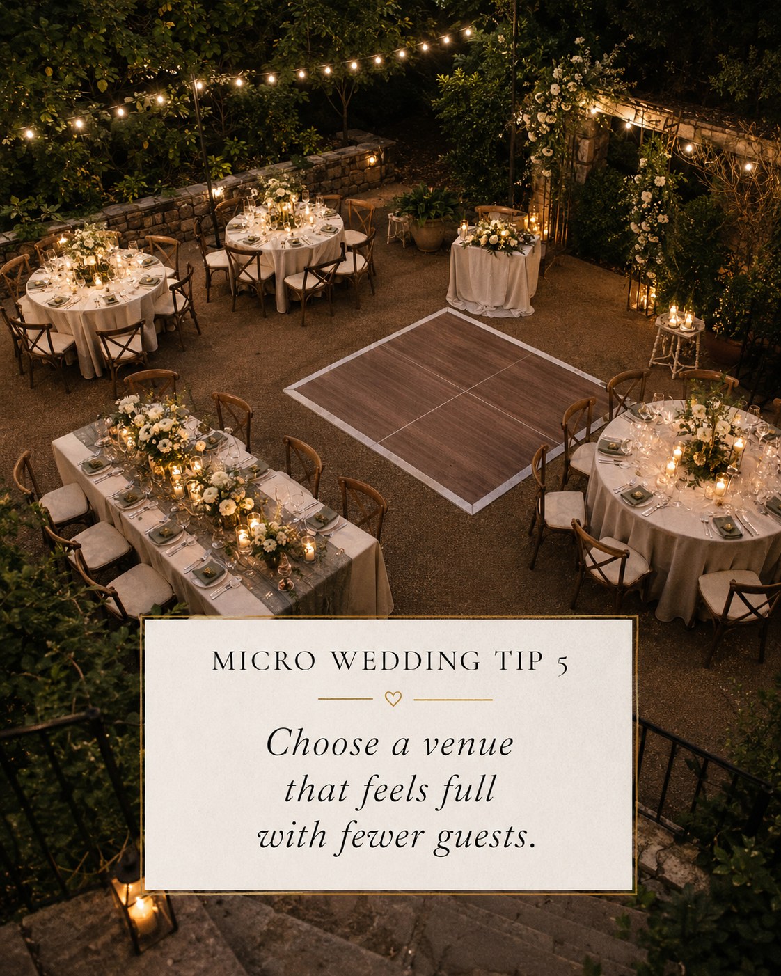 Aerial view of an intimate outdoor micro wedding reception venue lit with string lights and candles