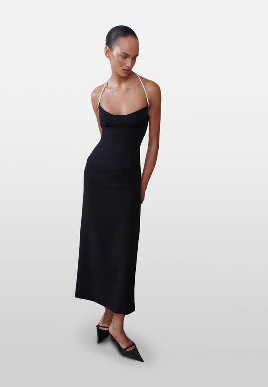 Minimalist black wedding guest dress