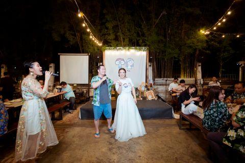 Wedding guests singing outdoor karaoke