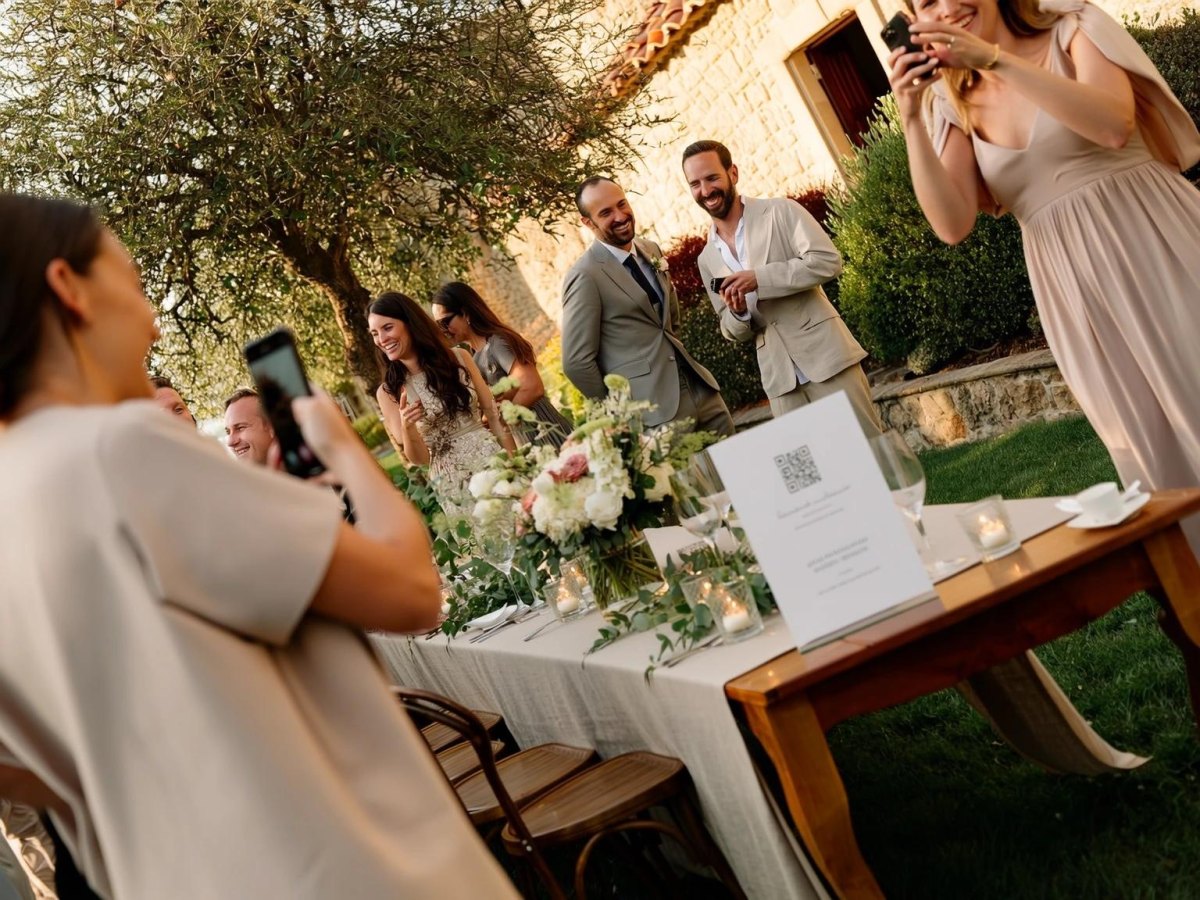 Wedding guests taking challenge photos outside