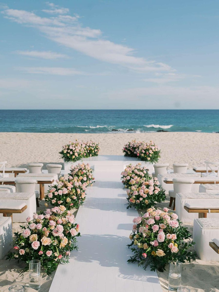 Pastel beach wedding aisle flowers