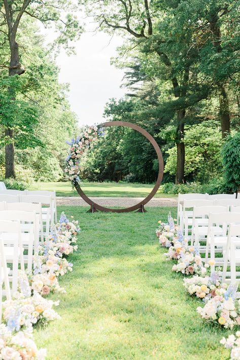 Pastel floral circle wedding aisle
