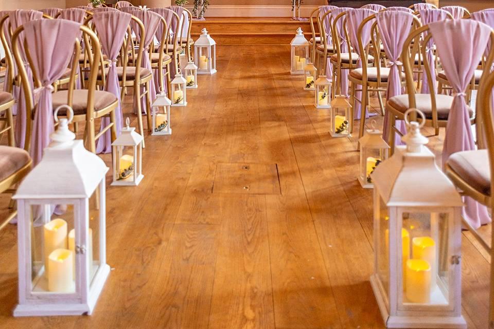 Pastel lanterns along wedding aisle