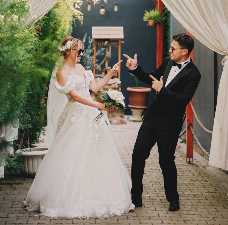 Playful bride and groom teasing