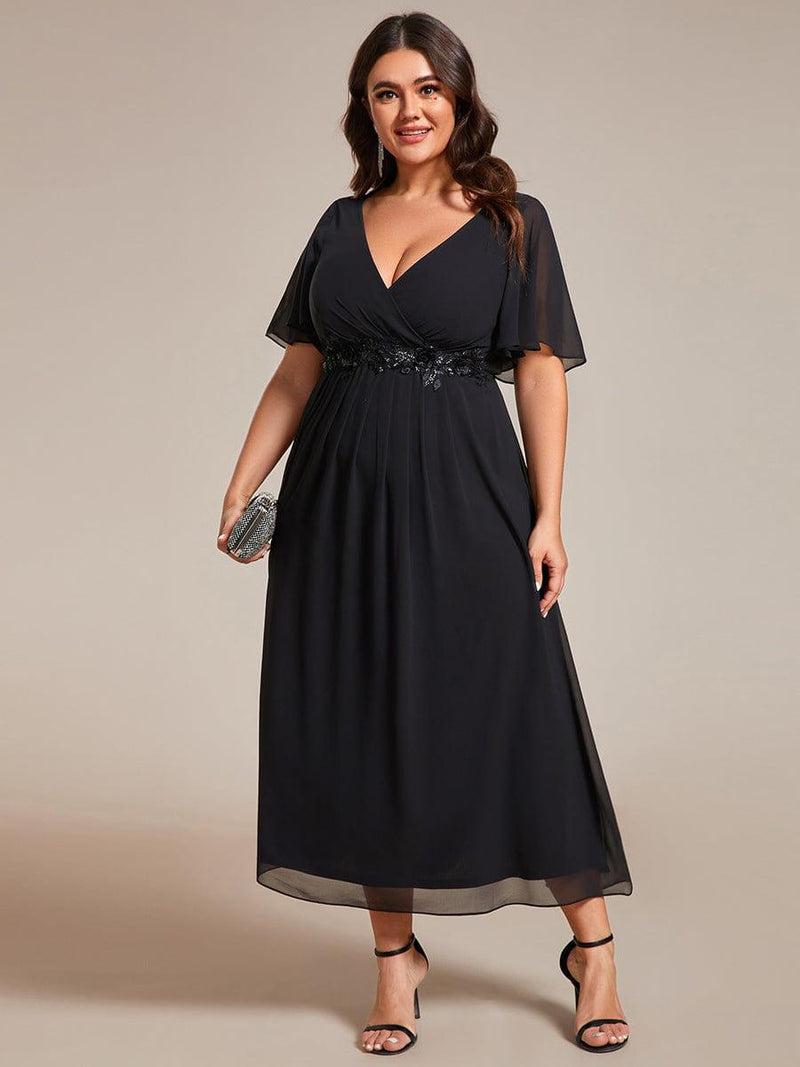 Plus size black wedding guest dress