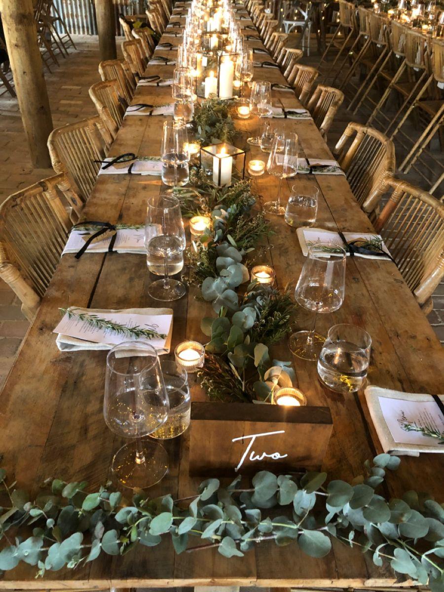 Rustic wedding table with candles and wood