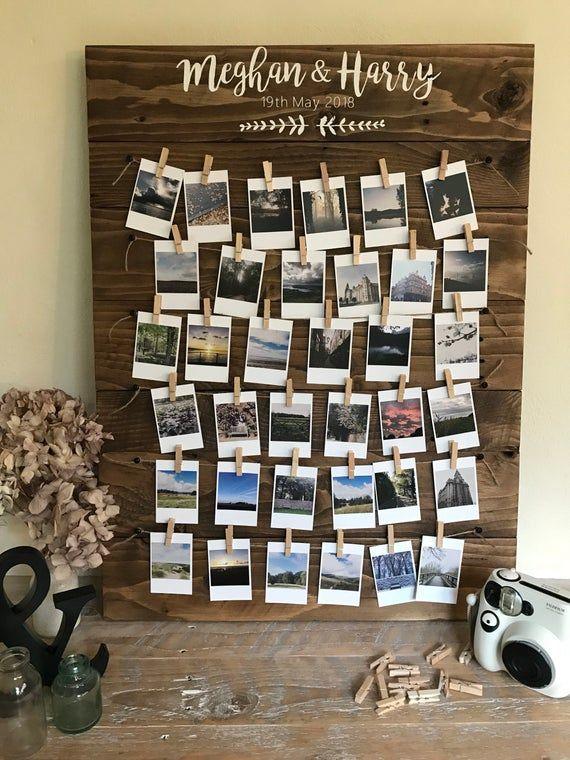Rustic wedding photo display board with clips