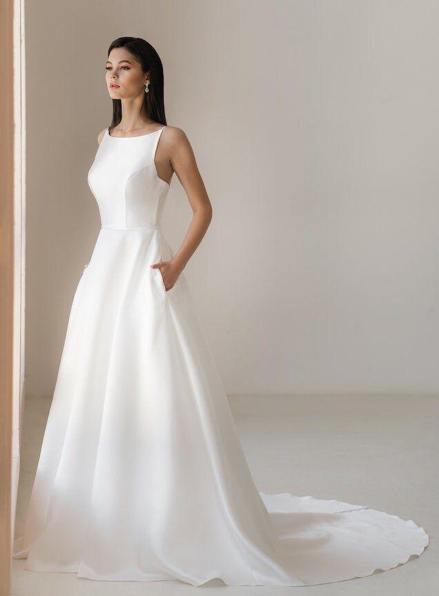Minimalist satin bridal gown with sleek silhouette
