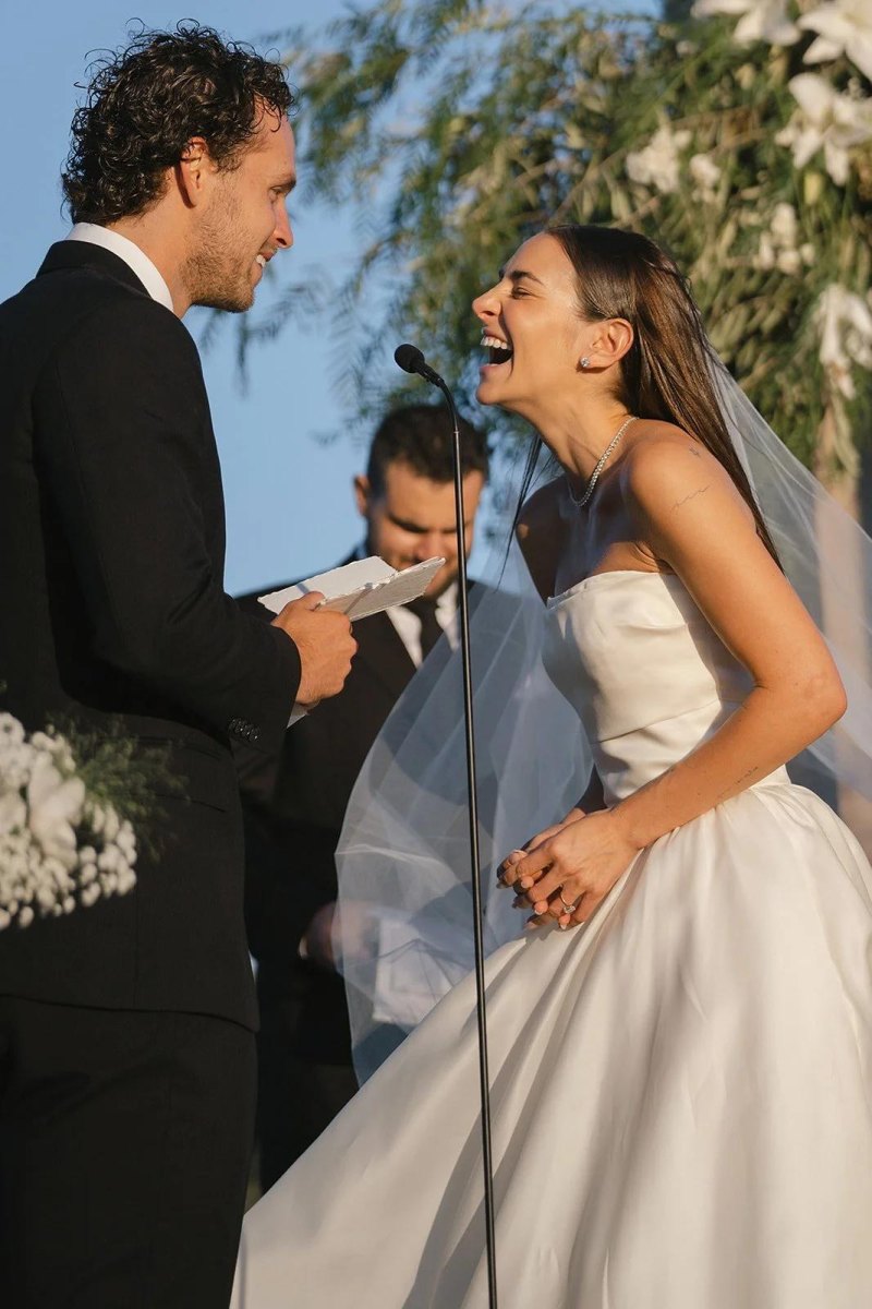 Bride and groom laughing while exchanging vows