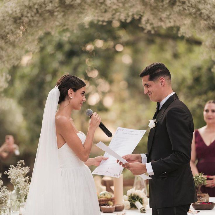 Couple exchanging words during a wedding reading outdoors