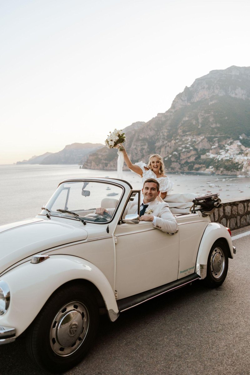 Couple celebrating scenic mountain elopement pose