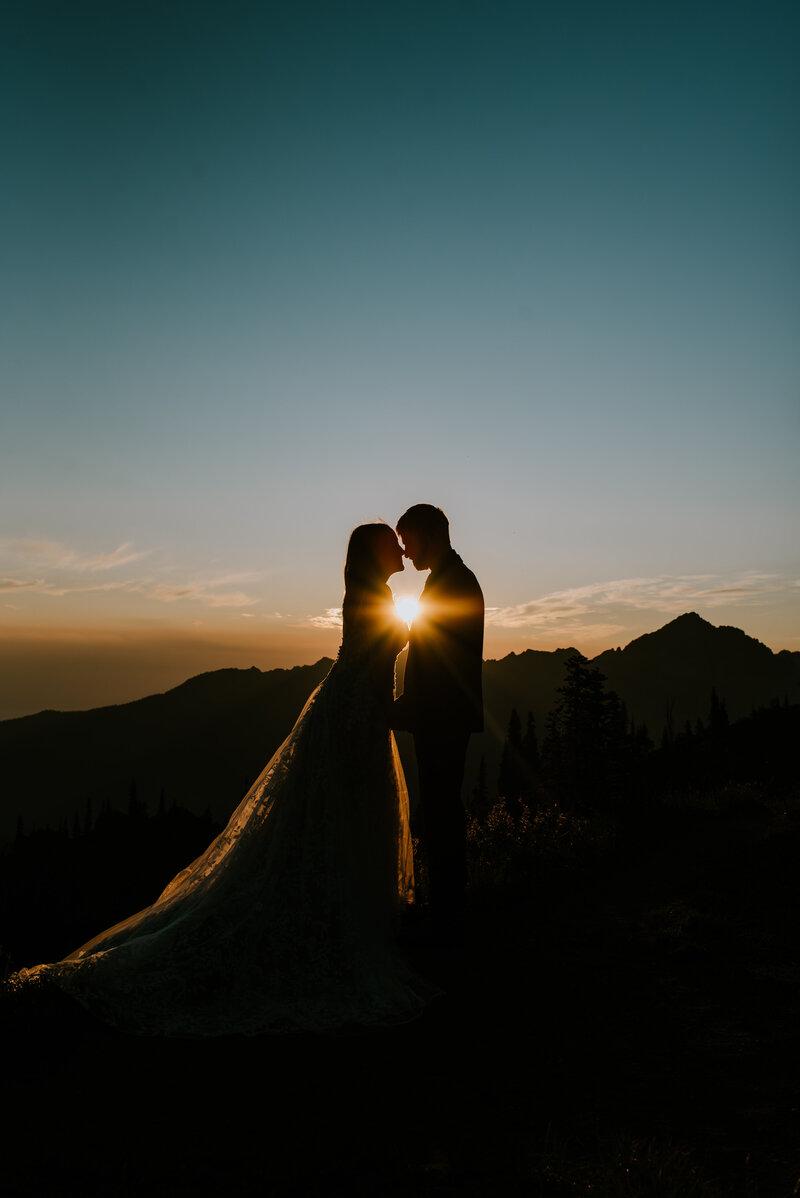 Couple celebrating mountains elopement photography pose