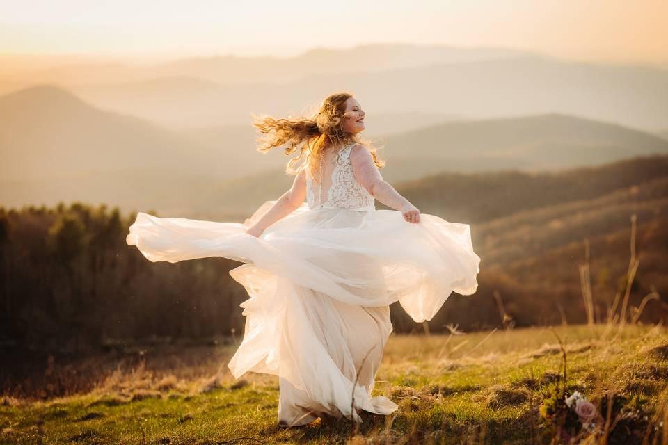 Bride spinning dress outdoor elopement photography pose