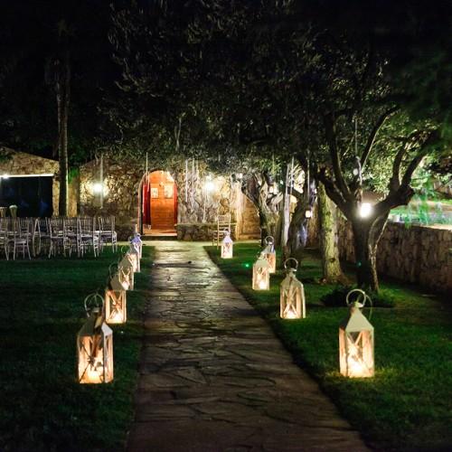 Vintage lantern pathway at evening wedding