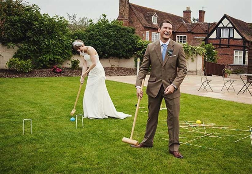Wedding croquet game on green lawn