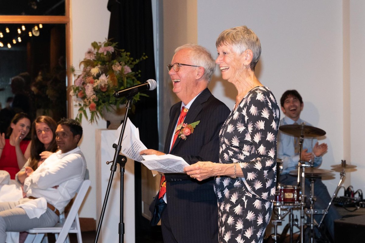 Parents giving emotional wedding speech