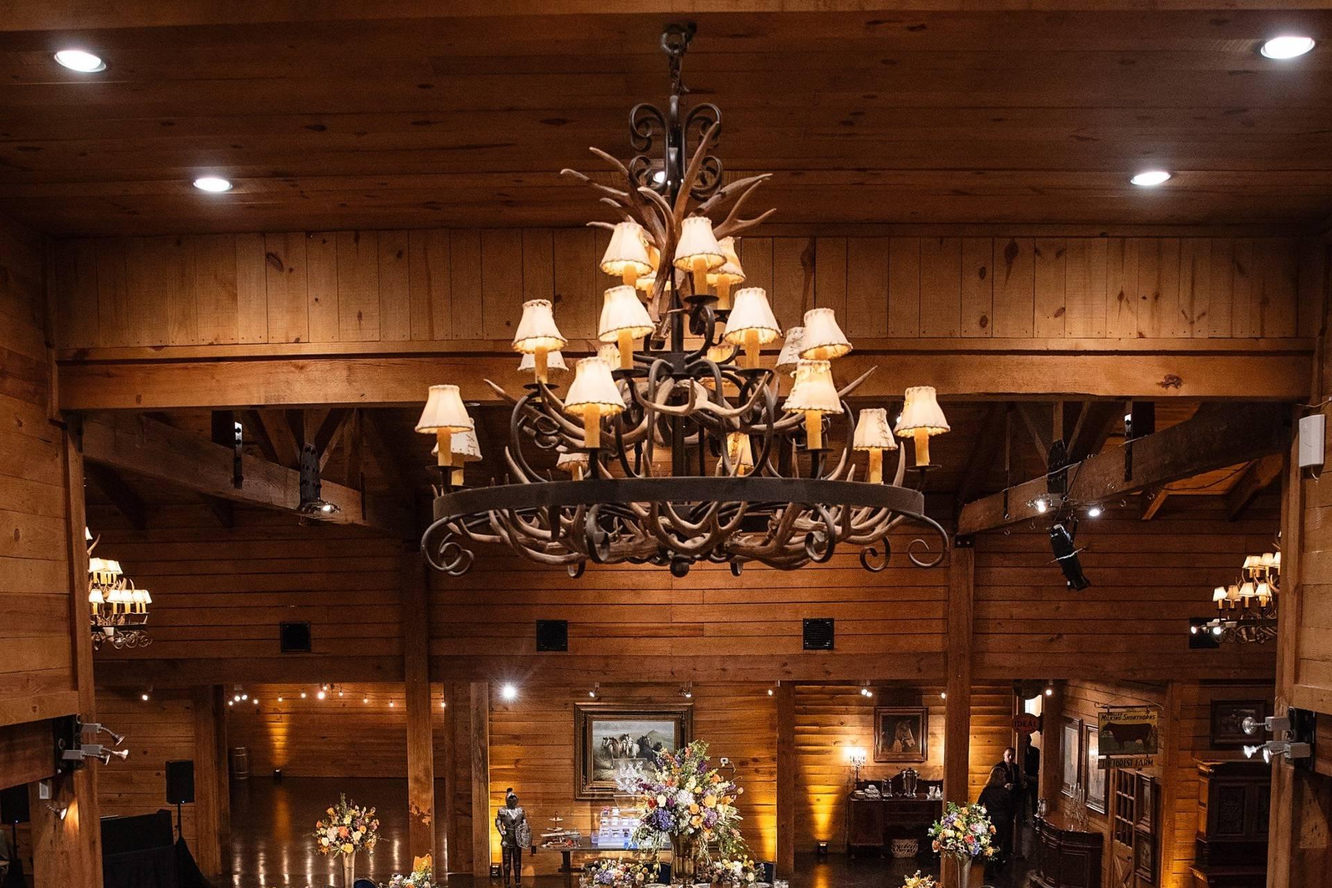 Wooden chandelier above rustic wedding table