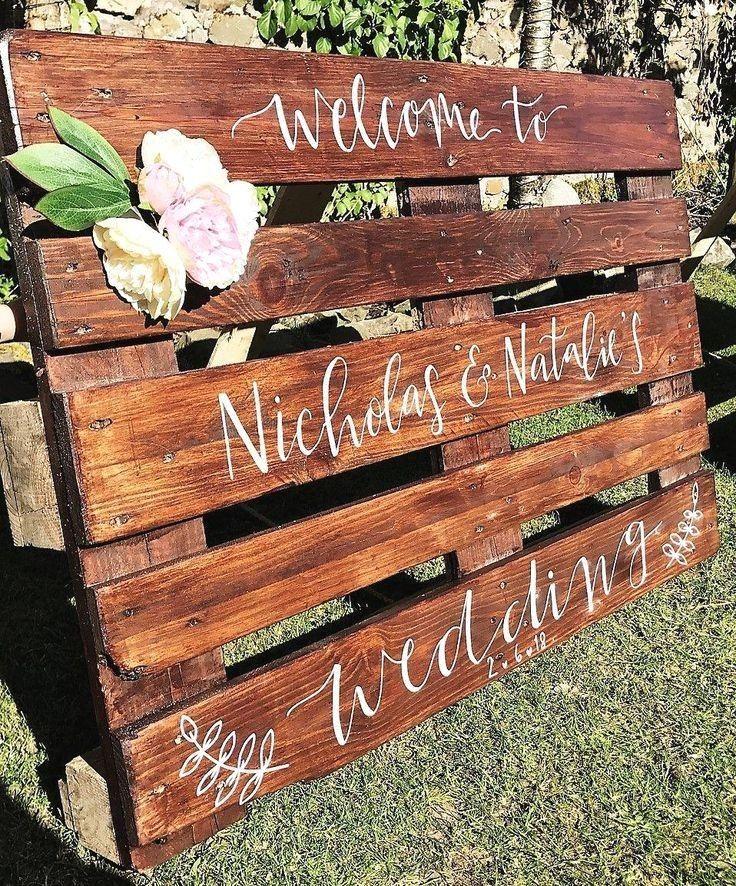 Wooden pallet wedding welcome sign outdoors